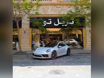 Porsche  911  Carrera  2024  Automatic  10,000 Km  6 Cylinder  Rear Wheel Drive (RWD)  Coupe / Sport  Gray  With Warranty