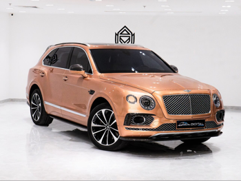 Bentley  Bentayga  2018  Automatic  82,640 Km  12 Cylinder  Four Wheel Drive (4WD)  SUV  Gold