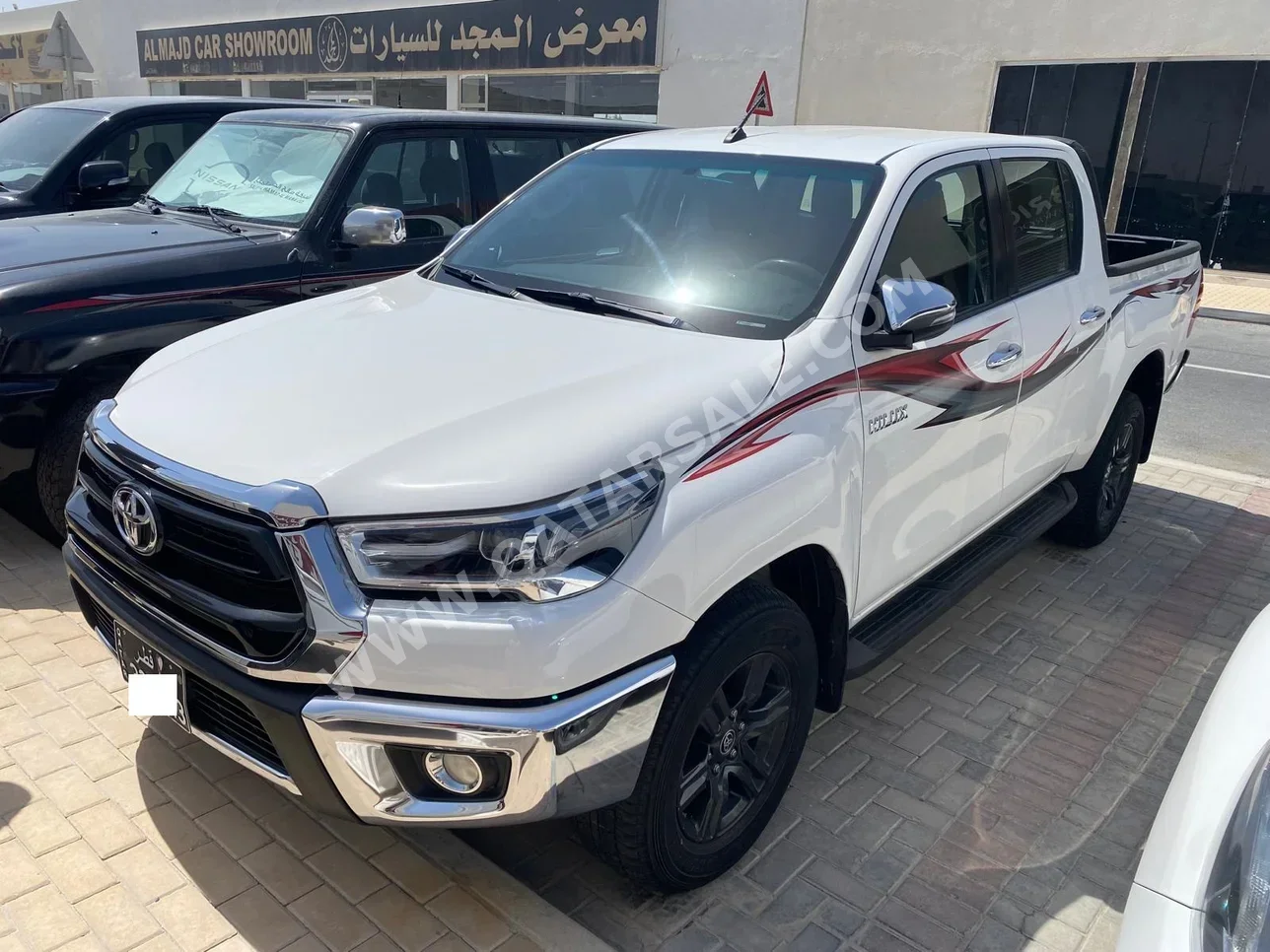 Toyota  Hilux  SR5  2023  Automatic  67,000 Km  4 Cylinder  Four Wheel Drive (4WD)  Pick Up  White  With Warranty