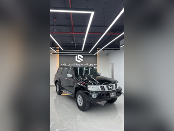 Nissan  Patrol  Safari  2024  Manual  65,000 Km  6 Cylinder  Four Wheel Drive (4WD)  SUV  Black  With Warranty
