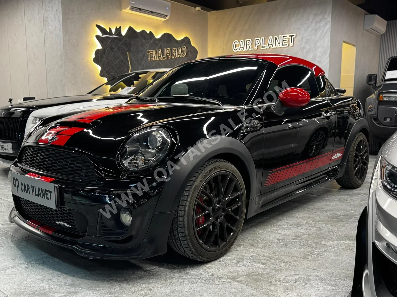 Mini  Cooper  JCW  2014  Automatic  98,000 Km  4 Cylinder  Front Wheel Drive (FWD)  Convertible  Black