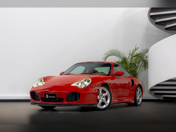 بورش  911  توربو  2002  اوتوماتيك  120,000 كم  6 سلندر  دفع خلفي  كوبيه \ سبورت  أحمر