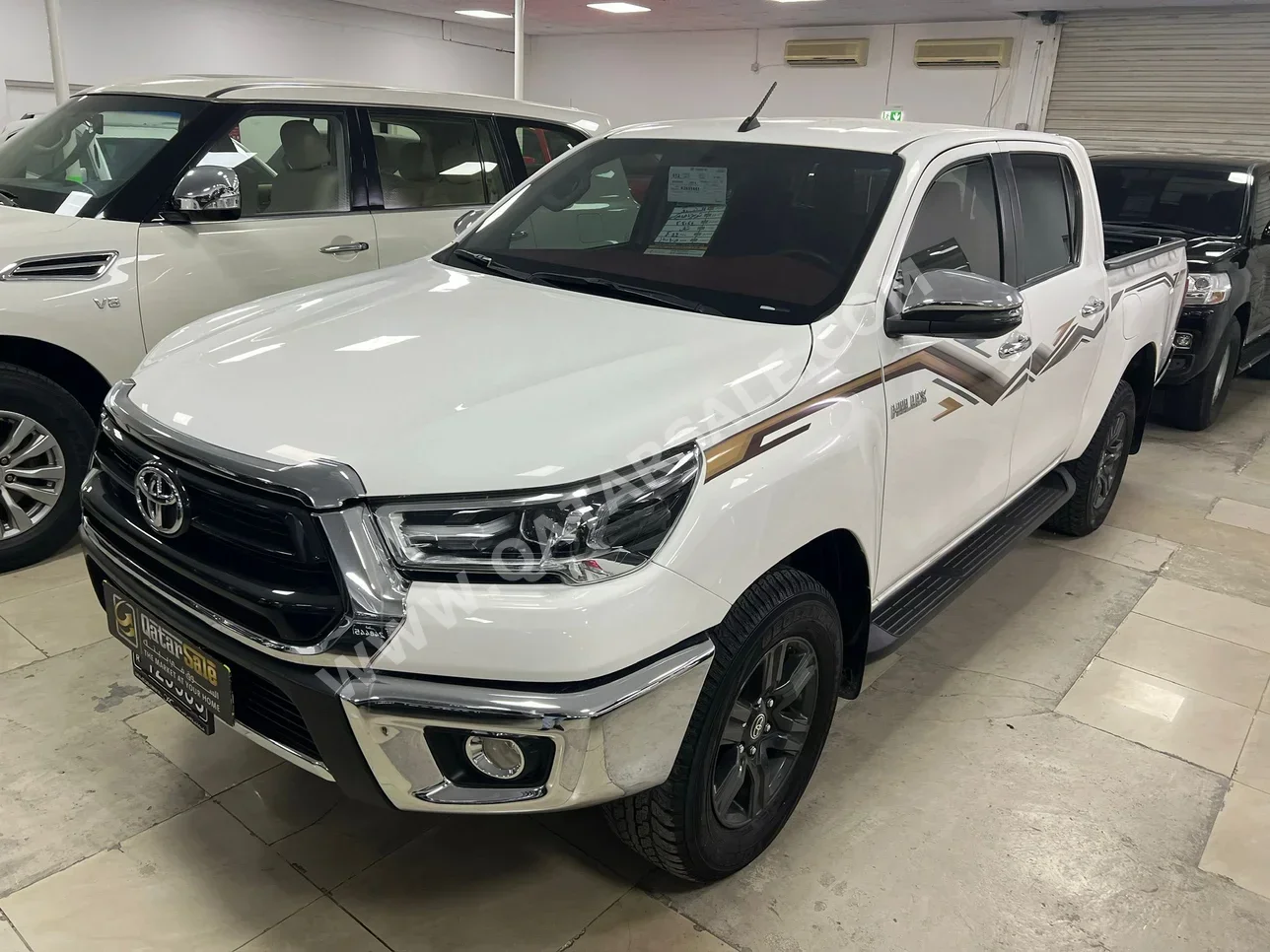 Toyota  Hilux  2024  Automatic  44,000 Km  4 Cylinder  Four Wheel Drive (4WD)  Pick Up  White  With Warranty