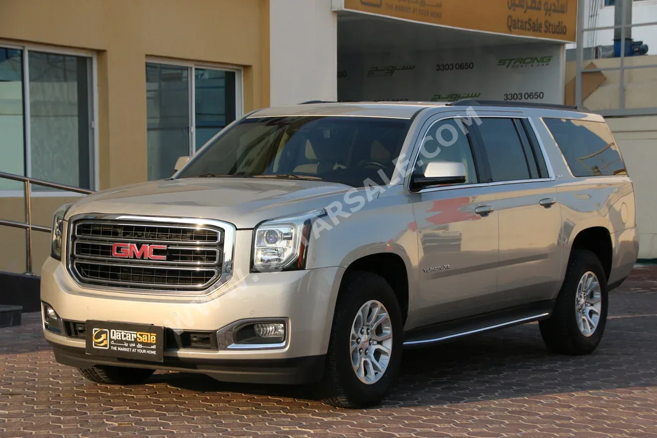GMC  Yukon  XL SLT  2016  Automatic  30,000 Km  8 Cylinder  Four Wheel Drive (4WD)  SUV  Gold