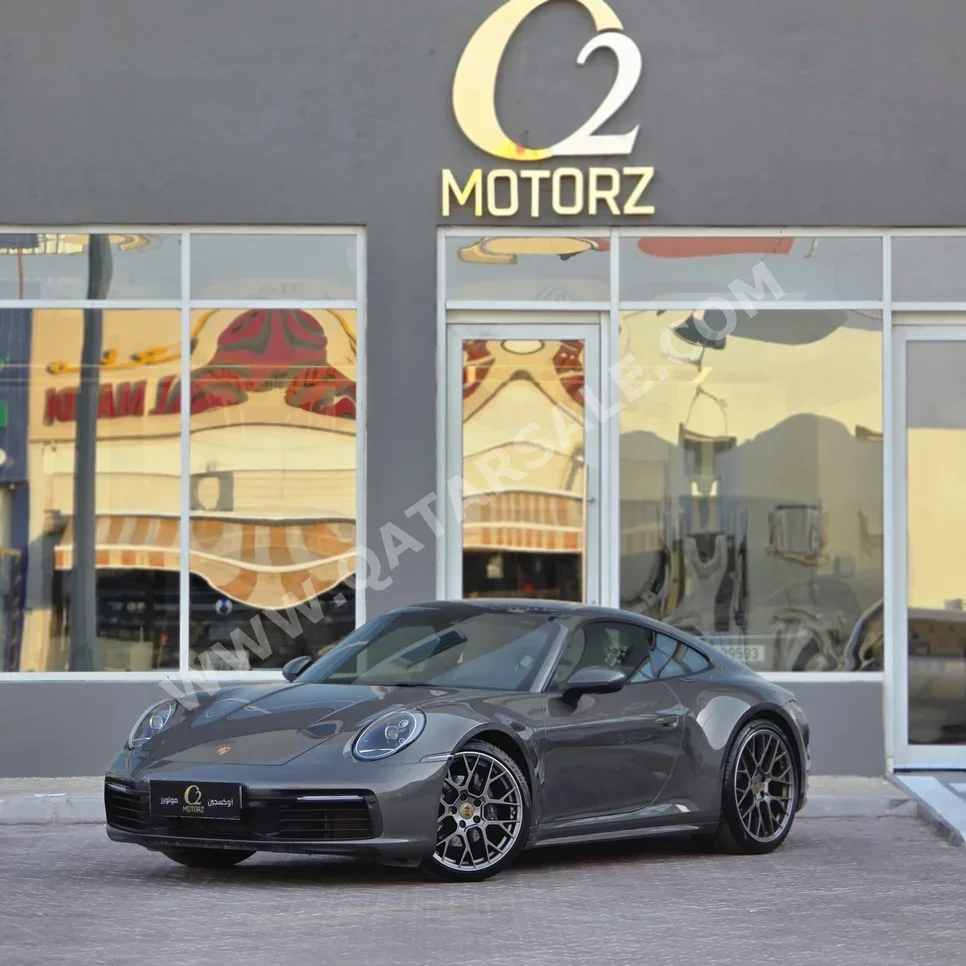 بورش  911  كاريرا  2021  اوتوماتيك  60,000 كم  6 سلندر  دفع خلفي  كوبيه \ سبورت  رمادي  تحت الضمان