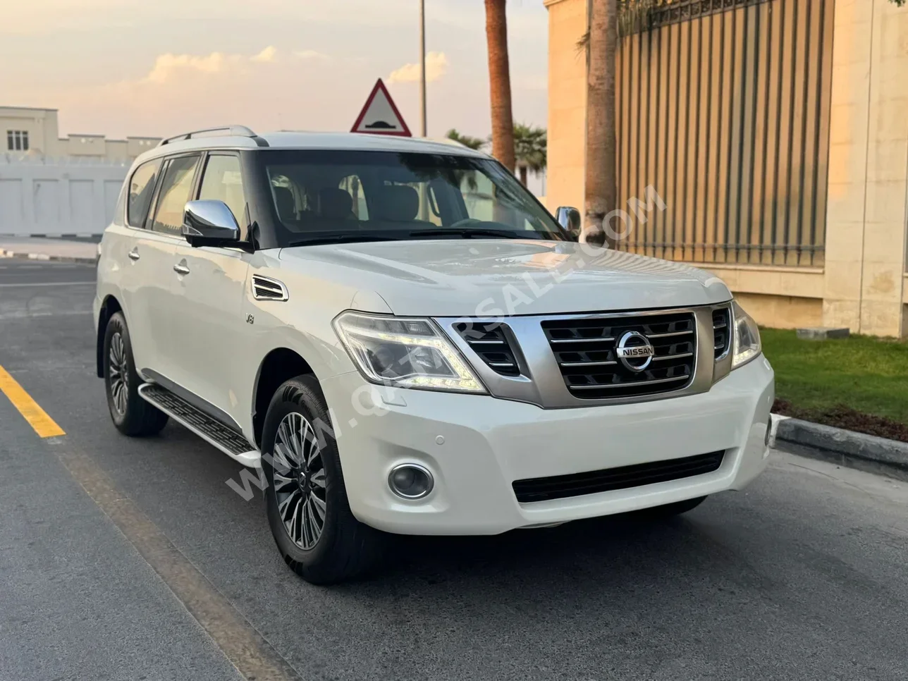 Nissan  Patrol  Platinum  2014  Automatic  310,000 Km  8 Cylinder  Four Wheel Drive (4WD)  SUV  White