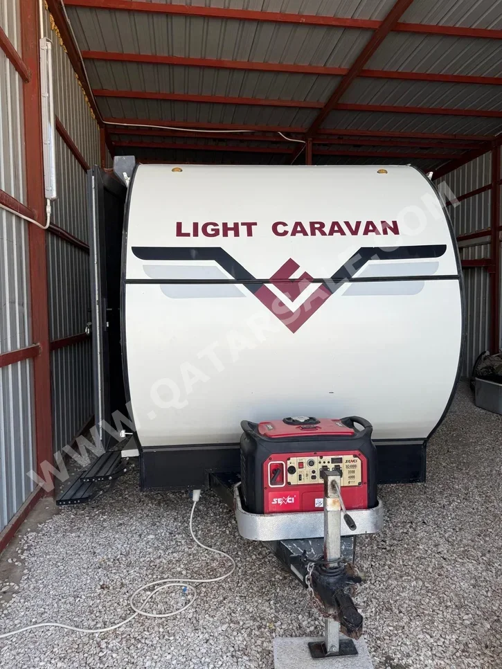 Caravan - 2022  - White  -Made in Qatar