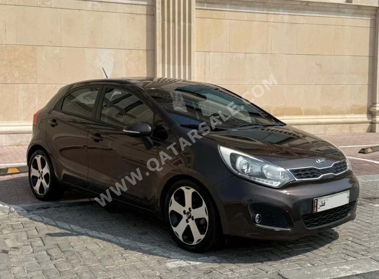 Kia  Rio  2015  Automatic  177,000 Km  4 Cylinder  Classic  Brown