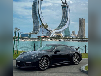 Porsche  911  Carrera  2022  Automatic  70,500 Km  6 Cylinder  Rear Wheel Drive (RWD)  Coupe / Sport  Black  With Warranty