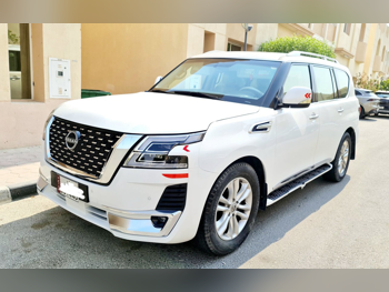 Nissan  Patrol  Platinum  2012  Automatic  142,350 Km  8 Cylinder  Four Wheel Drive (4WD)  SUV  Pearl