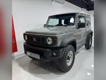 سوزوكي جمني جي ال 2021 عادي 120,000 كم 4 سلندر دفع خلفي سيدان رمادي غامق تحت الضمان