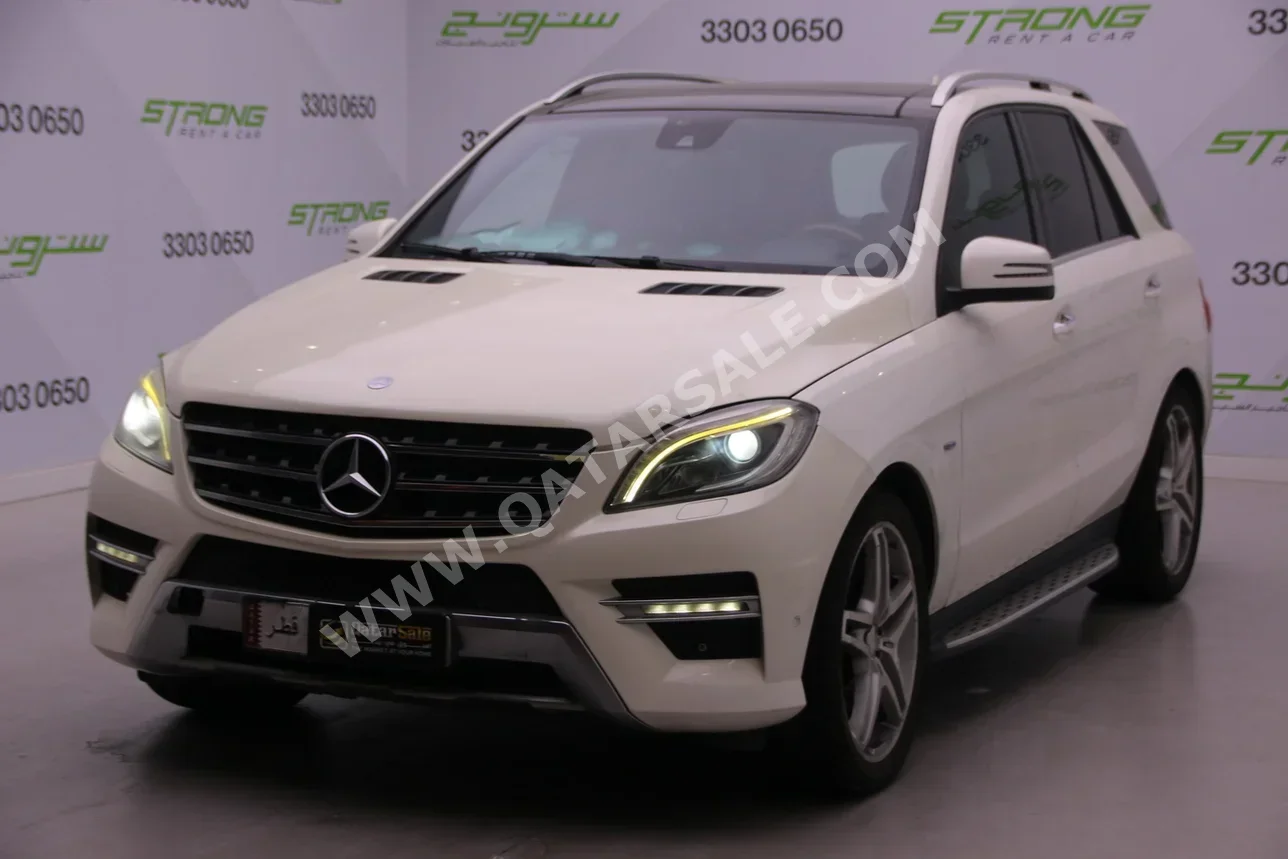 مرسيدس - بنز  ام ال  350  2013  اوتوماتيك  180,000 كم  6 سلندر  دفع رباعي  اس يو في  أبيض