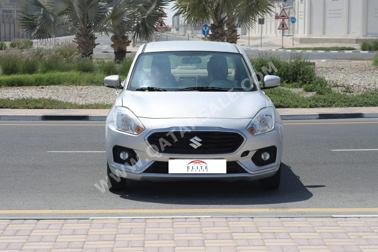 سوزوكي دي زاير 4 سلندر سيدان فضي 2018