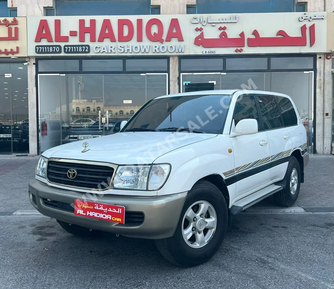 تويوتا لاند كروزر جي اكس ار 1999 عادي 531,000 كم 6 سلندر دفع رباعي اس يو في أبيض
