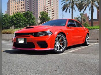 دودج تشارجر اس ار تي 2024 اوتوماتيك 6,000 كم 8 سلندر دفع خلفي سيدان برتقالي تحت الضمان