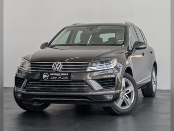 فوكس واغن  طوارق  سبورت  2015  اوتوماتيك  139,800 كم  6 سلندر  دفع كلي مستمر  اس يو في  بني