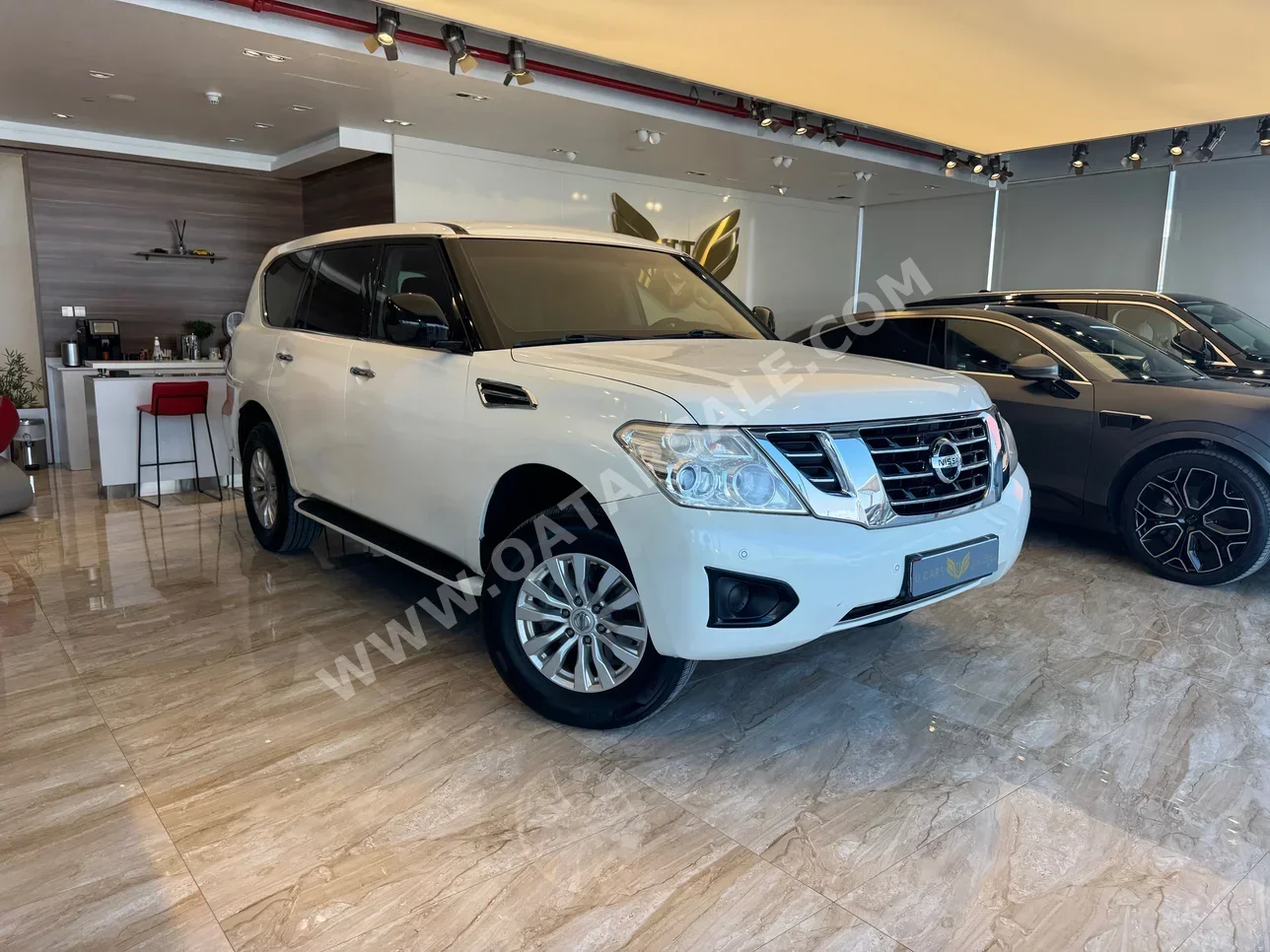 نيسان  باترول  أكس أي  2017  اوتوماتيك  165,000 كم  6 سلندر  دفع رباعي  اس يو في  أبيض