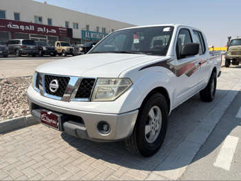 Nissan  Navara  SE  2012  Manual  290,000 Km  4 Cylinder  Rear Wheel Drive (RWD)  Pick Up  White