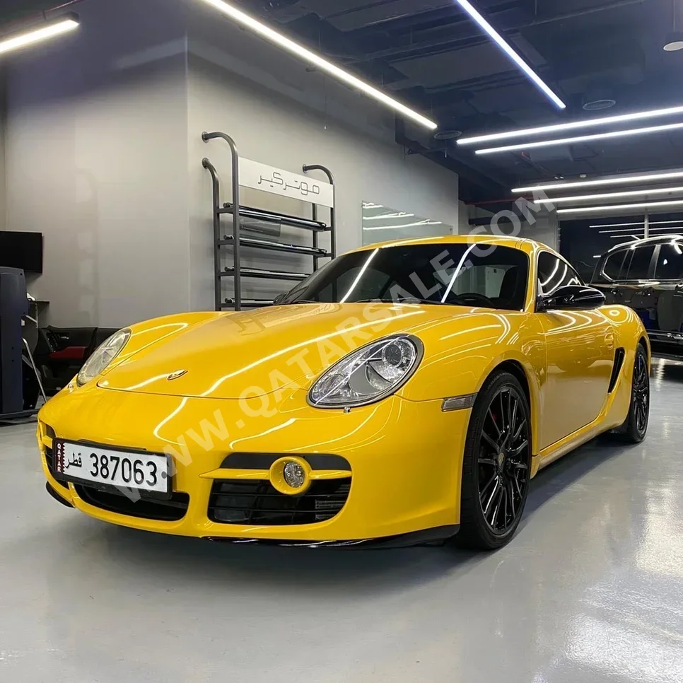 بورش كايمان اس 2008 اوتوماتيك 110,000 كم 6 سلندر دفع خلفي كوبيه \ سبورت أصفر تحت الضمان