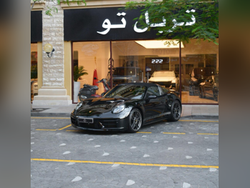 بورش  911  2022  اوتوماتيك  5,000 كم  6 سلندر  دفع خلفي  كوبيه \ سبورت  أسود  تحت الضمان