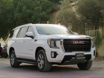 GMC  Yukon  SLE  2021  Automatic  104,000 Km  8 Cylinder  Four Wheel Drive (4WD)  SUV  White