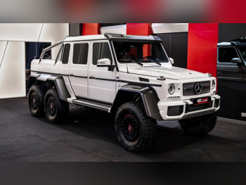 مرسيدس - بنز  جي - كلاس  63 اي ام جي  2014  اوتوماتيك  213 كم  8 سلندر  دفع رباعي  اس يو في  أبيض