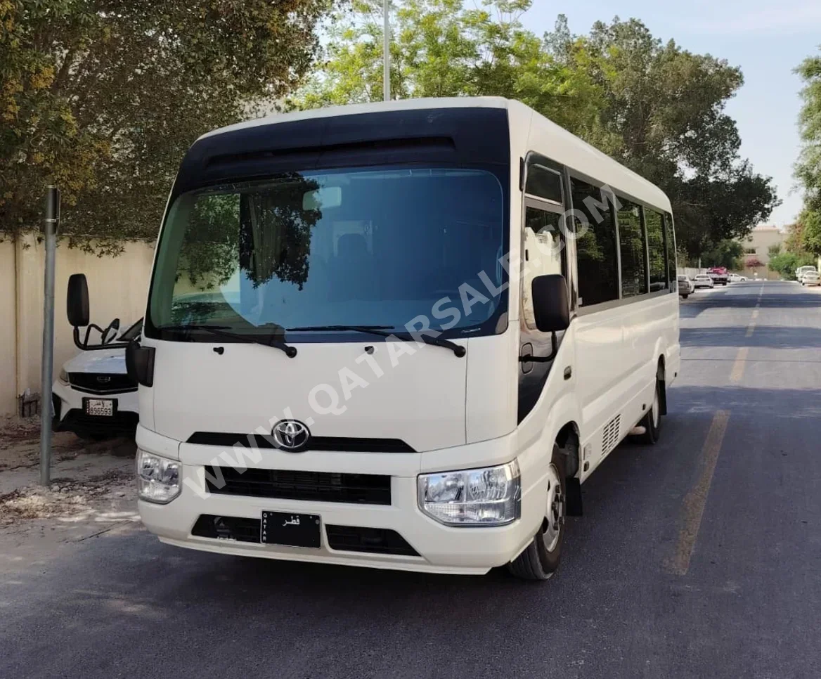 Toyota Coaster 2022 Manual 300,000 Km 4 Cylinder Rear Wheel Drive (RWD) Van / Bus White