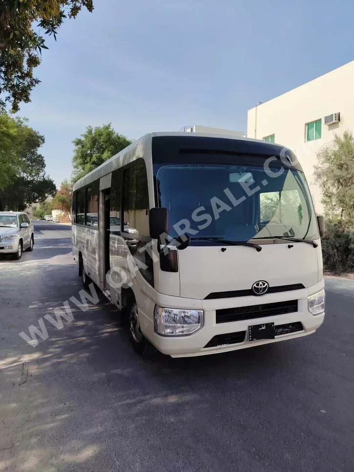 Toyota Coaster 2022 Manual 300,000 Km 4 Cylinder Rear Wheel Drive (RWD) Van / Bus White