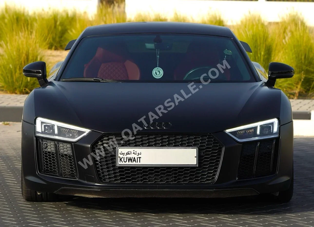 اودي  آر 8  Quattro FSI  2016  اوتوماتيك  26,700 كم  10 سلندر  دفع رباعي  كوبيه \ سبورت  أسود
