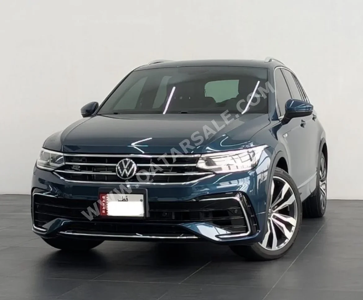 فوكس واغن تيغوان ار لاين 2023 اوتوماتيك 35,608 كم 4 سلندر دفع رباعي سيدان ازرق تحت الضمان