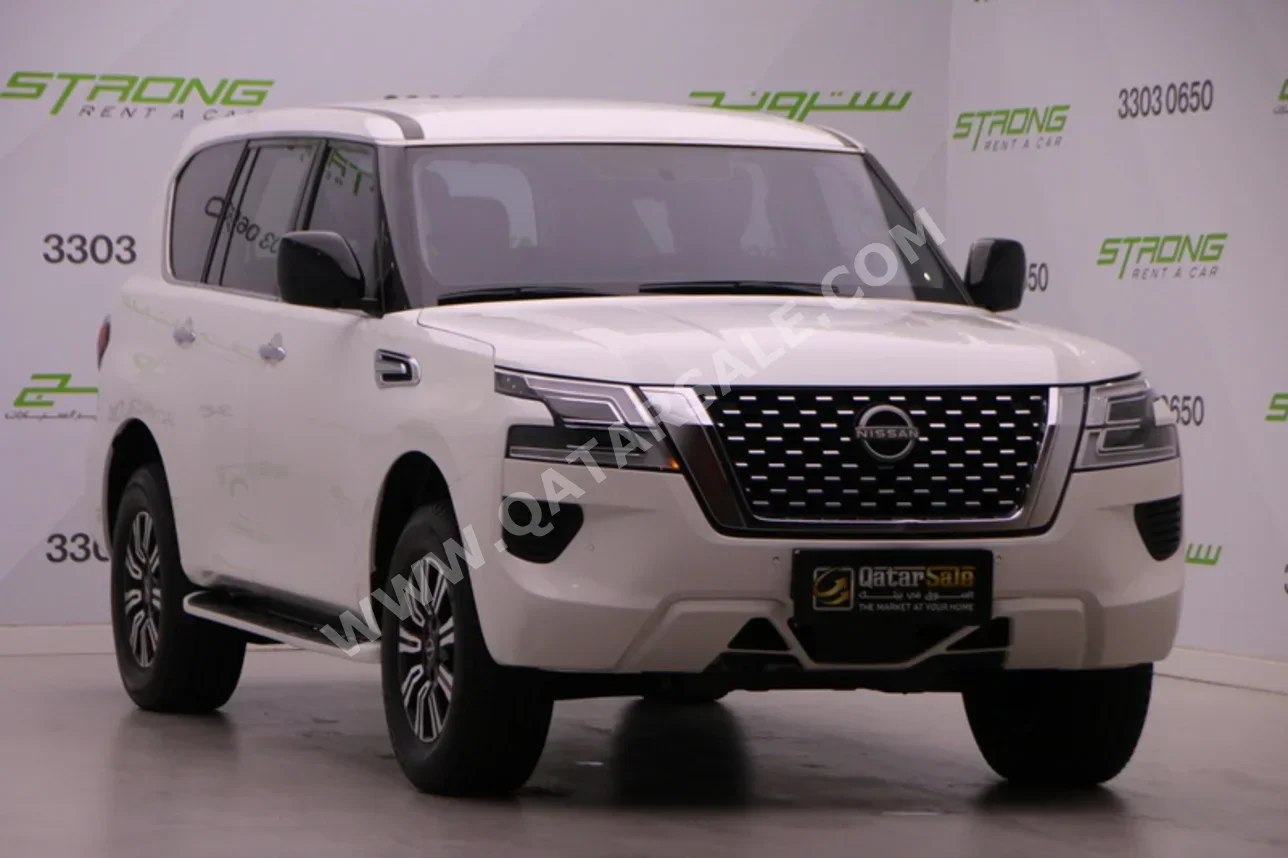 نيسان باترول أكس أي 2022 اوتوماتيك 114,000 كم 6 سلندر دفع رباعي اس يو في أبيض تحت الضمان