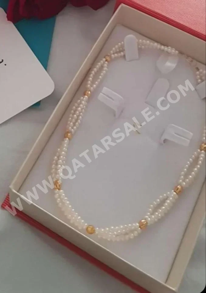 الذهب قلادة  قطر  نسائي  حسب القطعة ( ديزاينرز)  طبيعة  ذهب أصفر  عيار 21