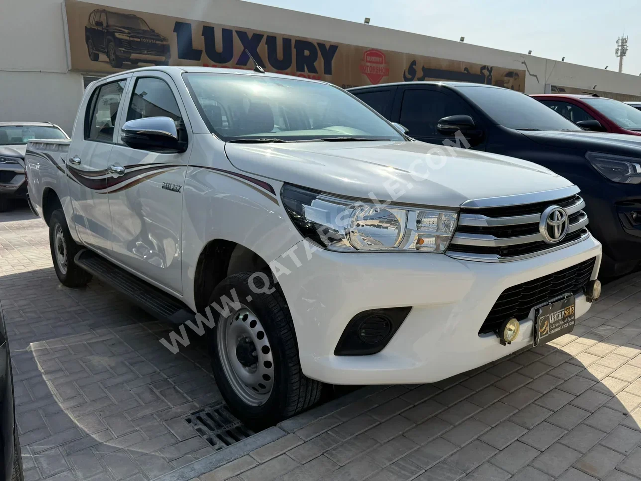 Toyota  Hilux  2019  Automatic  125,000 Km  4 Cylinder  Four Wheel Drive (4WD)  Pick Up  White