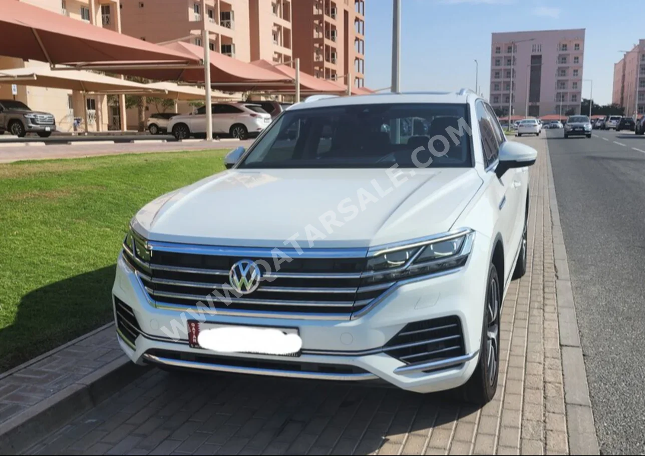 فوكس واغن  طوارق  هاي لاين بلس  2019  اوتوماتيك  140,000 كم  6 سلندر  دفع كلي مستمر  اس يو في  أبيض  تحت الضمان