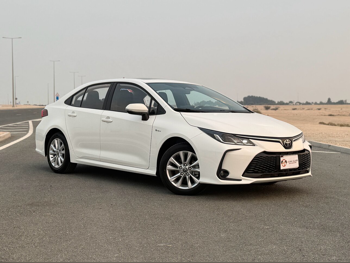 Toyota  Corolla  Hybrid  2025  Automatic  0 Km  4 Cylinder  Front Wheel Drive (FWD)  Sedan  White  With Warranty