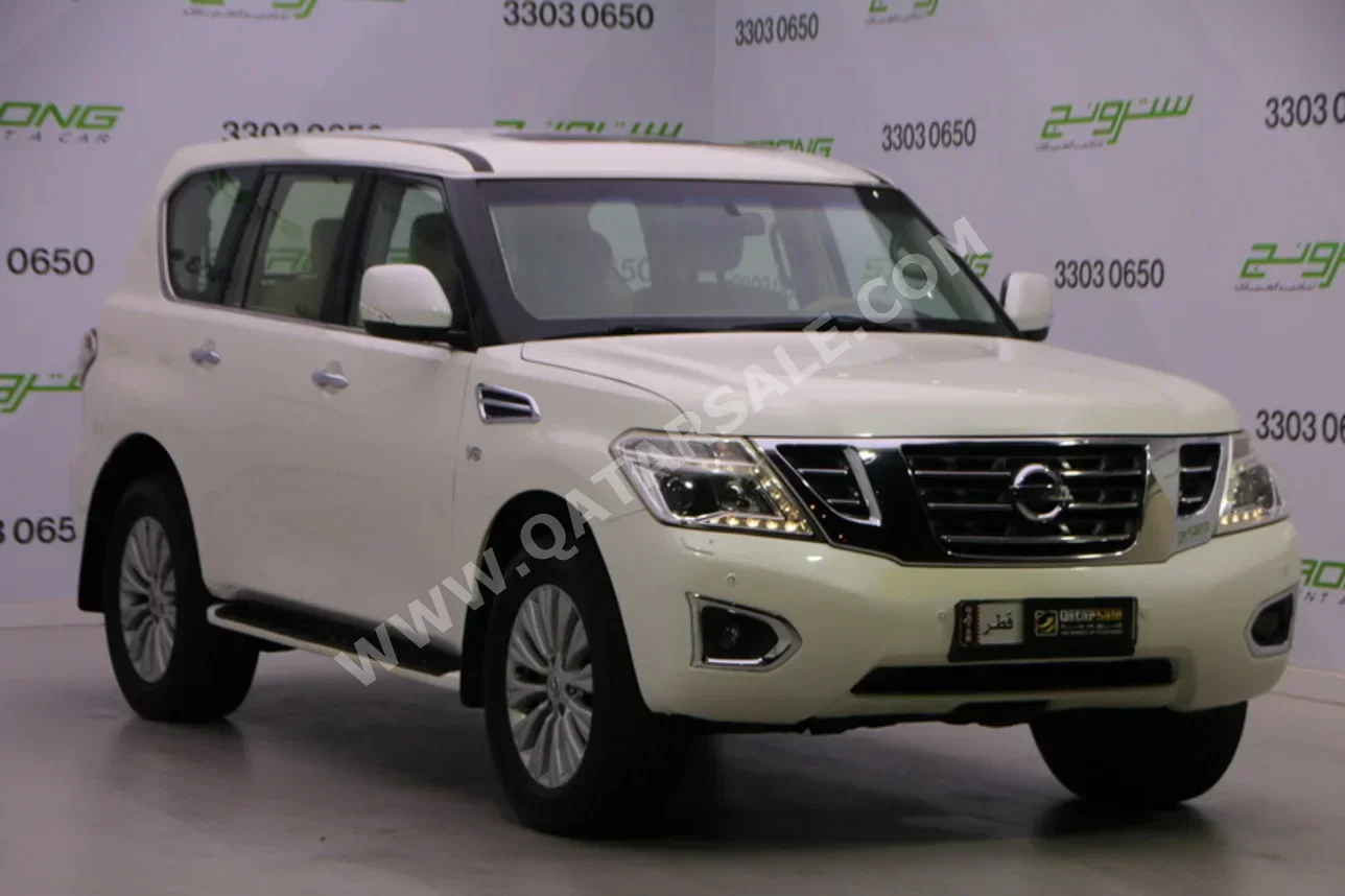 نيسان باترول ال اي 2014 اوتوماتيك 218,000 كم 8 سلندر دفع رباعي اس يو في أبيض