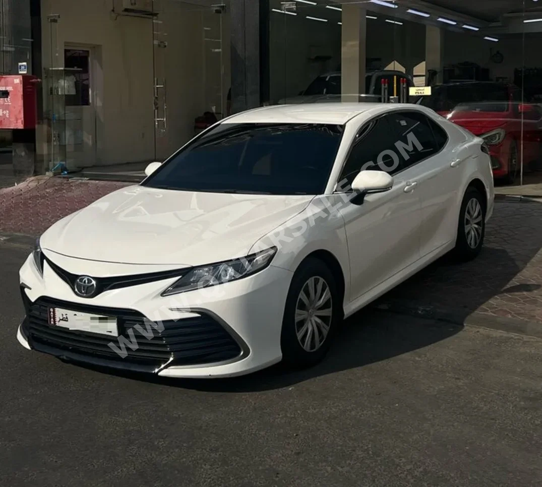 Toyota  Camry  LE  2023  Automatic  84,000 Km  4 Cylinder  Front Wheel Drive (FWD)  Sedan  White  With Warranty