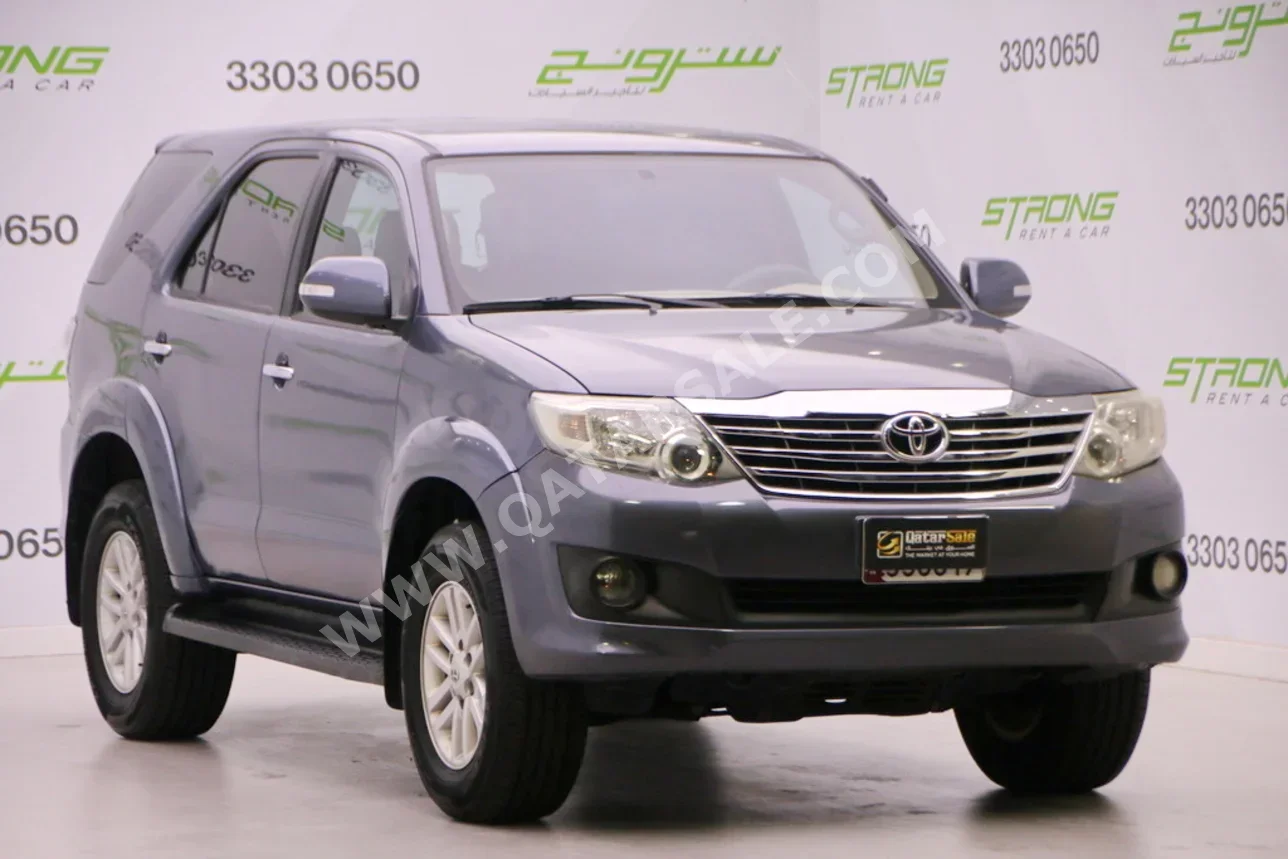Toyota  Fortuner  2013  Automatic  164,000 Km  4 Cylinder  Four Wheel Drive (4WD)  SUV  Gray