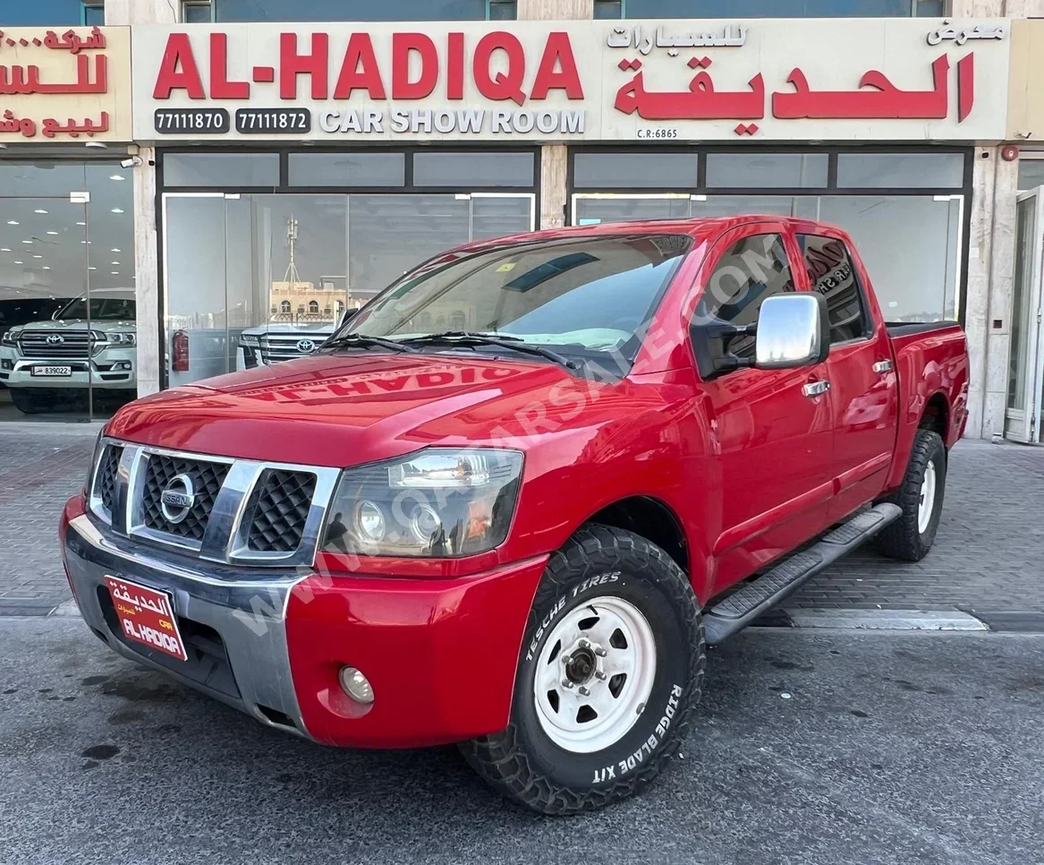 Nissan  Navara  2009  Automatic  211,000 Km  4 Cylinder  Rear Wheel Drive (RWD)  Pick Up  Red