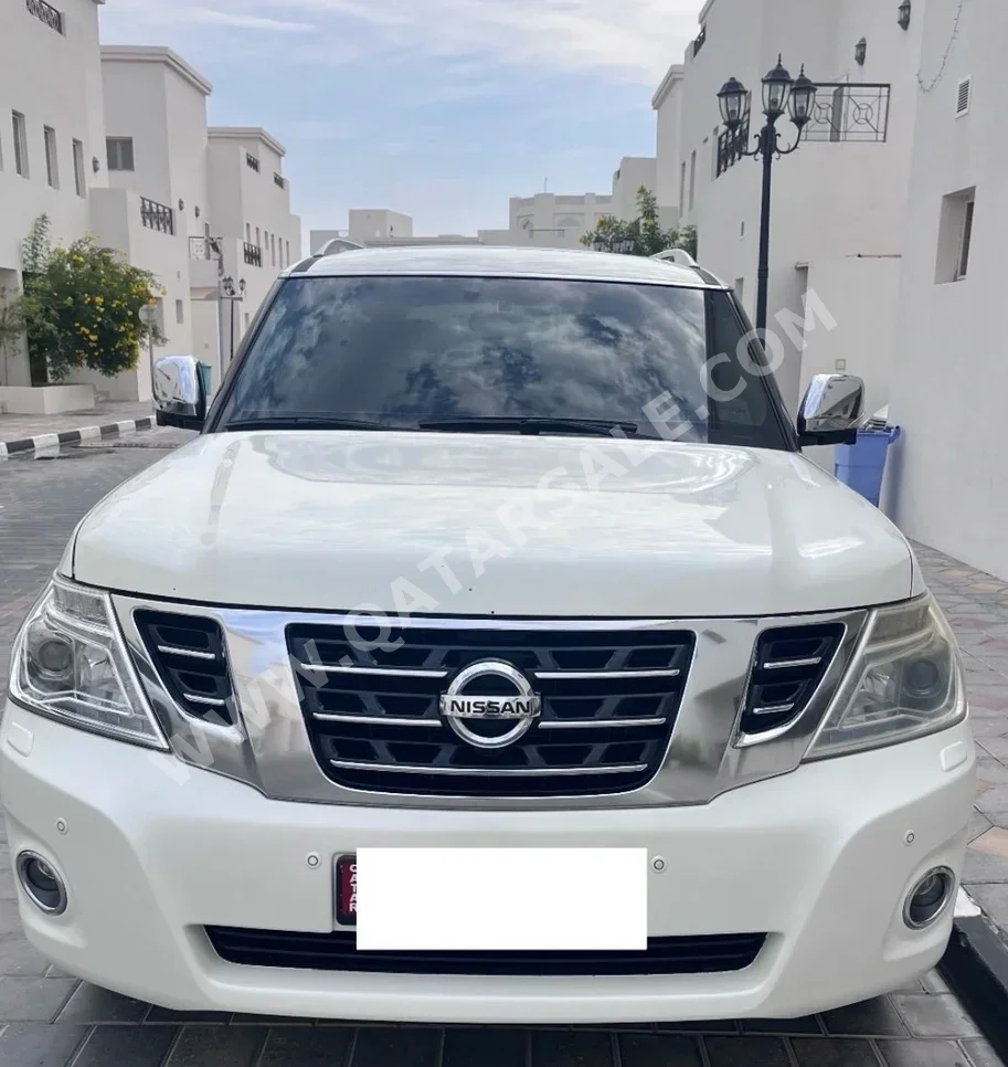 Nissan  Patrol  Platinum  2015  Automatic  224,000 Km  8 Cylinder  Four Wheel Drive (4WD)  SUV  White