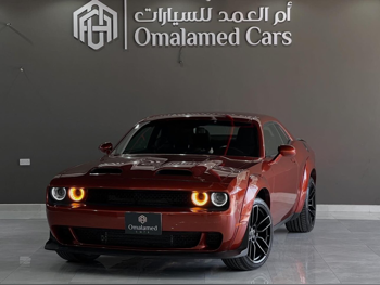 Dodge  Challenger  2022  Automatic  65,000 Km  6 Cylinder  Rear Wheel Drive (RWD)  Coupe / Sport  Orange