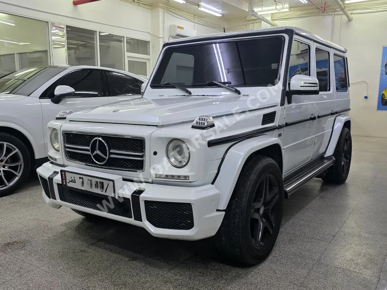 مرسيدس - بنز جي - كلاس 55 اي ام جي 2008 اوتوماتيك 176,000 كم 8 سلندر دفع رباعي اس يو في أبيض