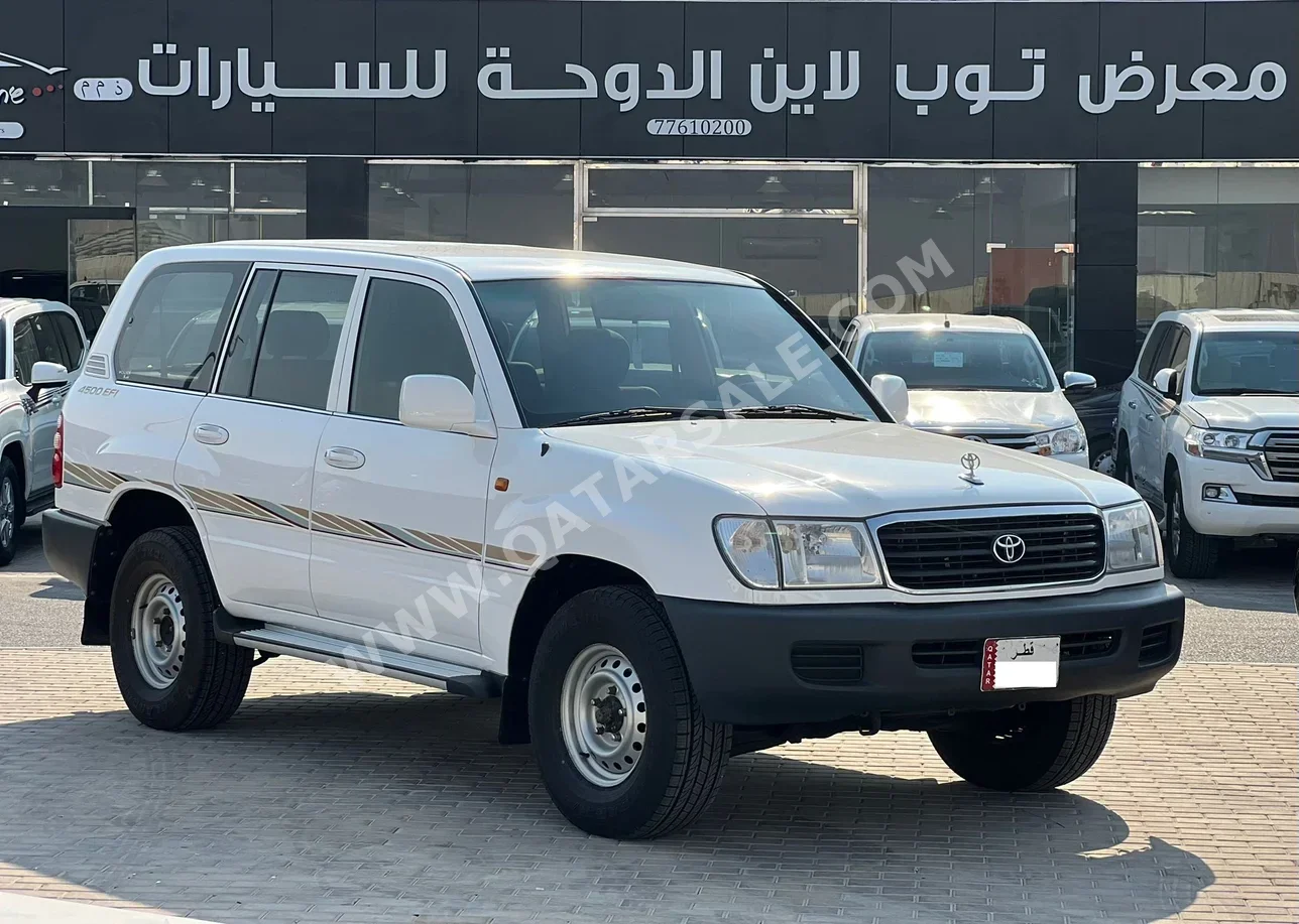 تويوتا لاند كروزر جي اكس 2002 عادي 700,000 كم 6 سلندر دفع رباعي اس يو في أبيض