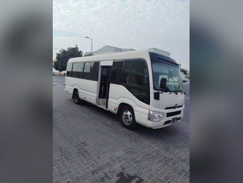 Toyota  Coaster  2019  Manual  159,000 Km  4 Cylinder  Rear Wheel Drive (RWD)  Van / Bus  White