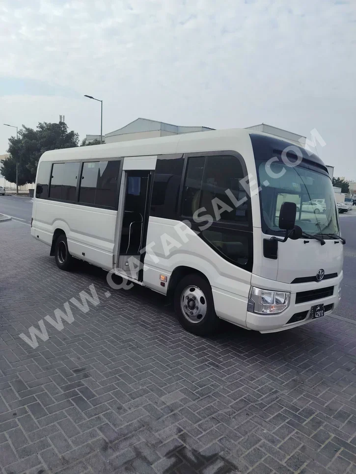 Toyota  Coaster  2019  Manual  159,000 Km  4 Cylinder  Rear Wheel Drive (RWD)  Van / Bus  White