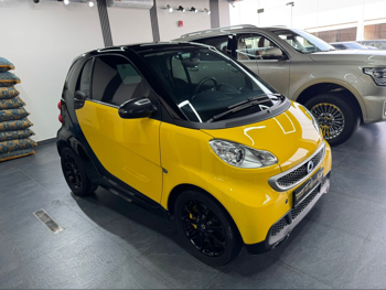 سمارت فور تو 2014 اوتوماتيك 17,000 كم 3 سلندر دفع خلفي هاتشباك أصفر