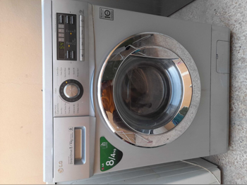 غسالة ملابس & الكل في واحد ال جي \ غسالة تحميل أمامي فضة