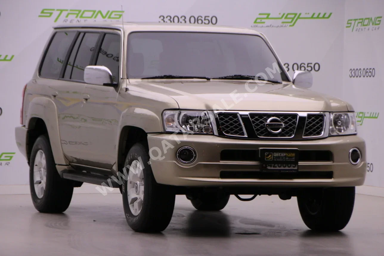 نيسان باترول سوبر سفاري 2006 عادي 127,000 كم 6 سلندر دفع رباعي اس يو في ذهبي