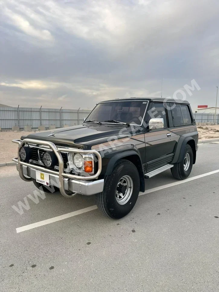نيسان باترول سوبر سفاري 1993 عادي 270,000 كم 6 سلندر دفع رباعي اس يو في أسود