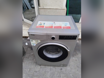 غسالة ملابس & الكل في واحد فيستيل \ غسالة تحميل أمامي اللون الرمادي